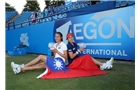 EASTBOURNE, ENGLAND - JUNE 21:  Hao-Ching and Yung-Jan Chan of Chinese Taipei pose with the trophy after beating Martina Hingis of Switzerland and Flavia Pennetta of Italy during their Women's Doubles Finals match on day eight of the Aegon International at Devonshire Park on June 21, 2014 in Eastbourne, England. (Photo by Jan Kruger/Getty Images)